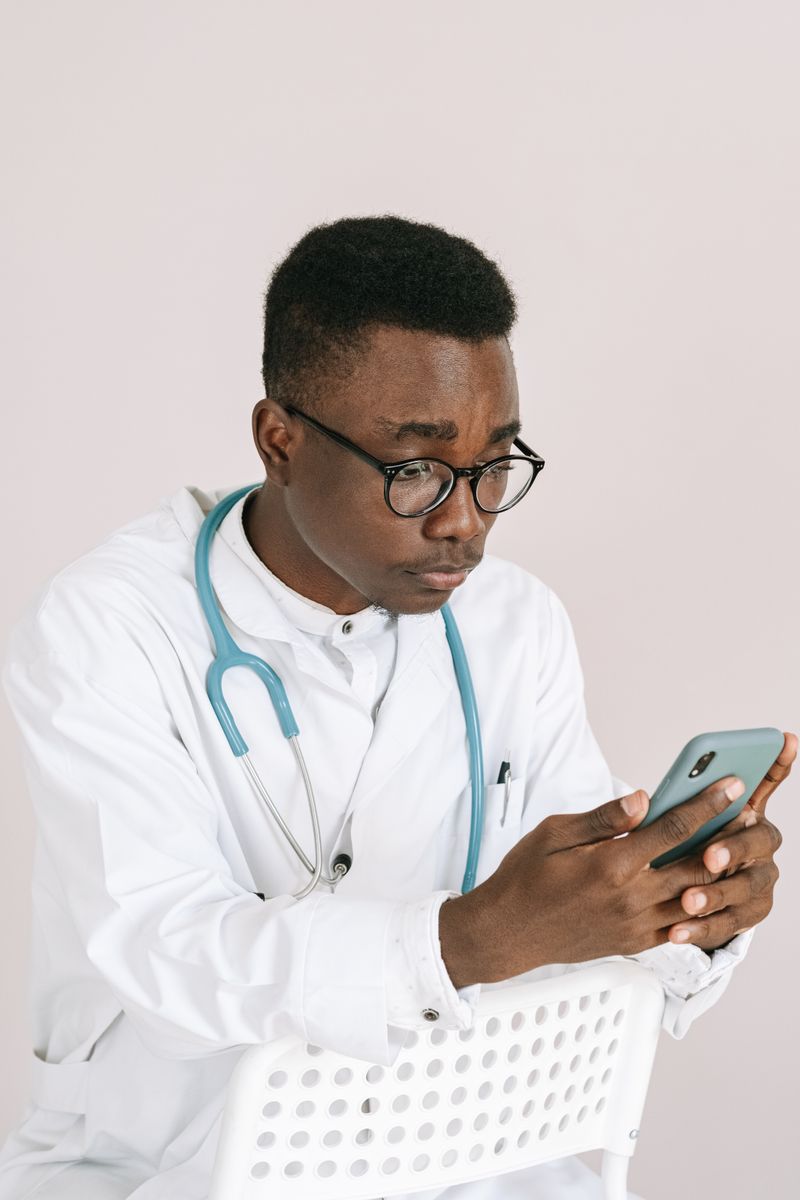 A healthcare professional reviewing information on a mobile device